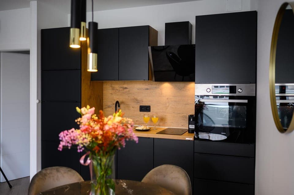 Kitchen or kitchenette, dishwasher, oven, stove