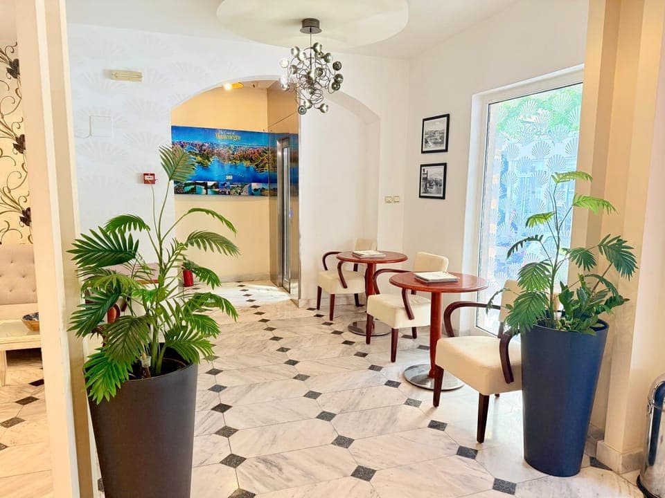 Property building, Lobby or reception, Seating area, furniture, furniture, furniture, elevator