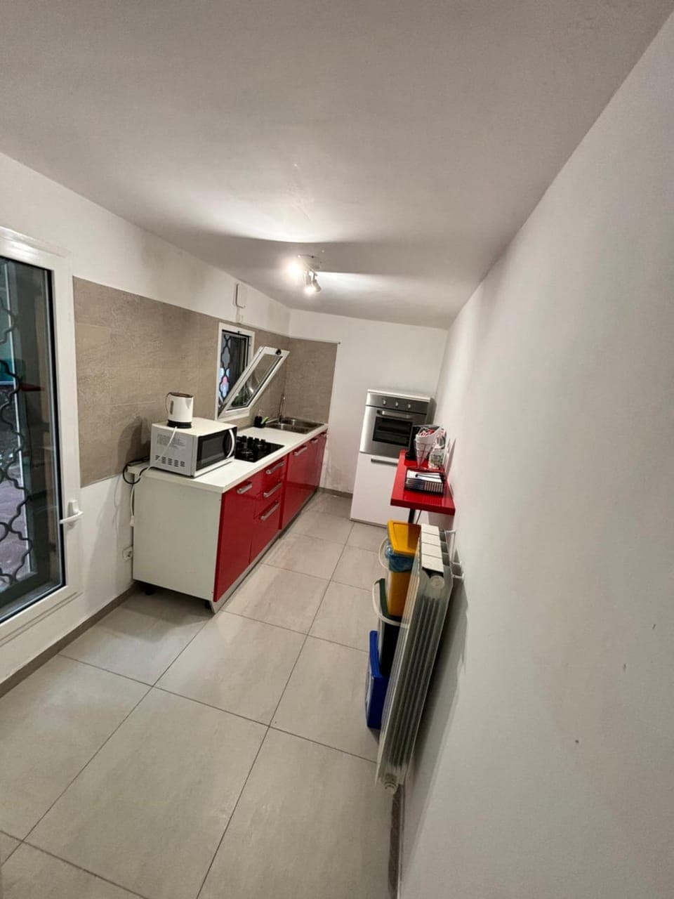 Kitchen or kitchenette, dishwasher, oven, stove
