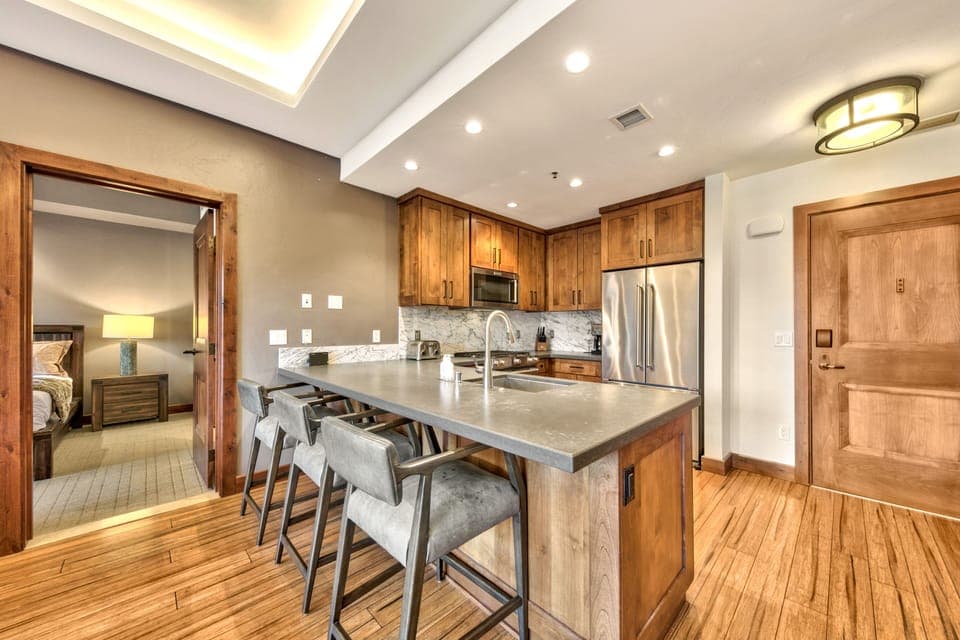 Open concept kitchen with modern stainless steel appliances