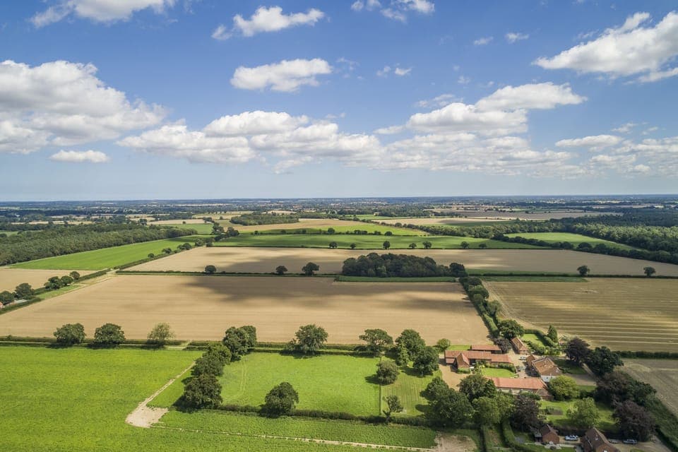 The patchwork arable landscape of the surrounding area