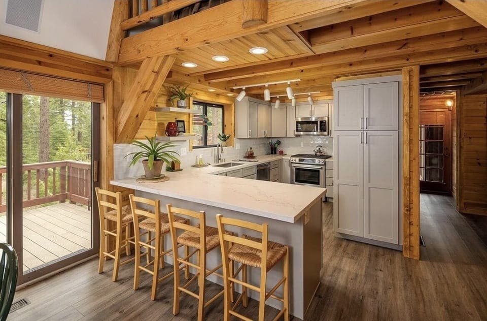 Newly renovated kitchen with four breakfast bar chairs