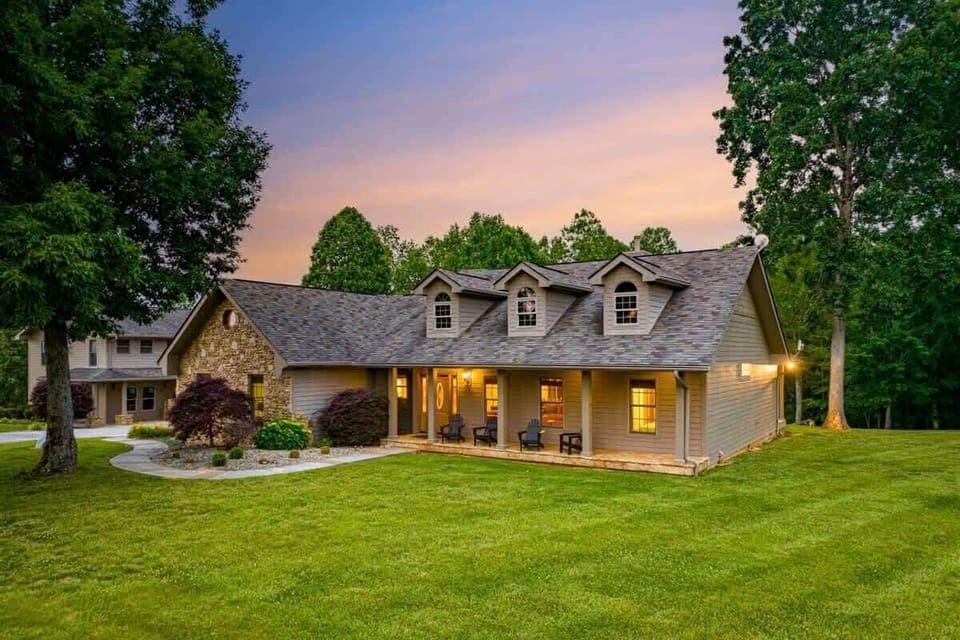 Such a Charming Exterior! Relax on the porch and soak in stunning sunset views amidst nature's embrace!