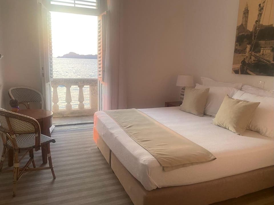 Romantic Double Room, Balcony, Sea View | 1 bedroom, in-room safe, desk, iron/ironing board
