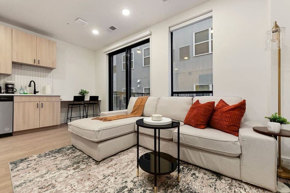 Living Room With Tons of Natural Light + Patio Access