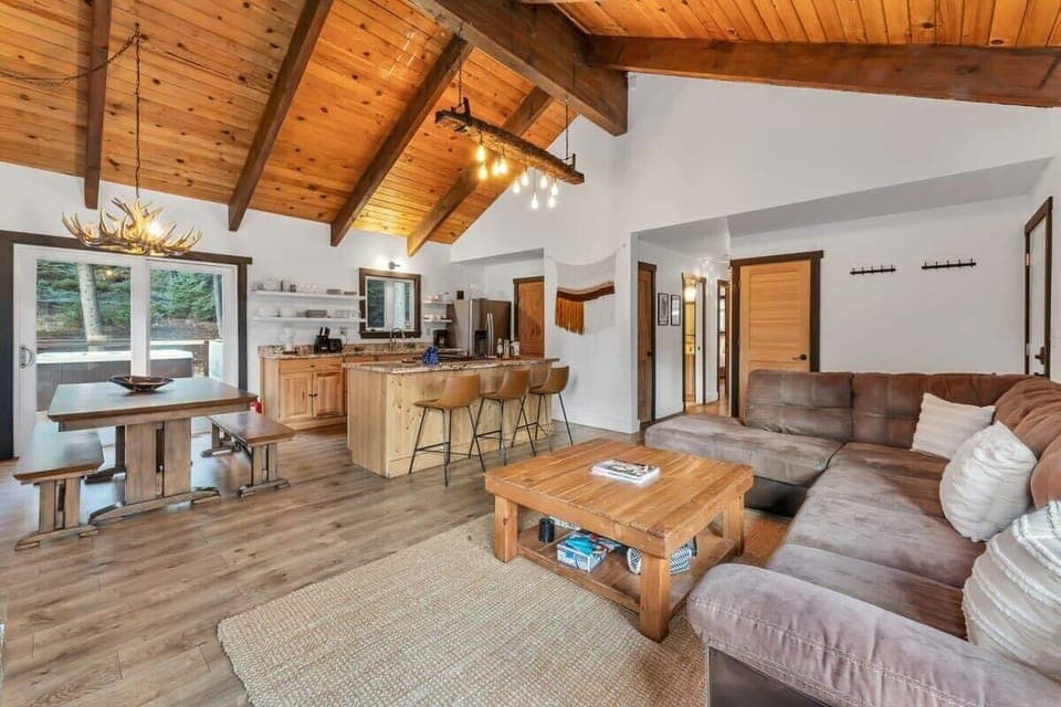 The open floor plan seamlessly blends seating, dining, and relaxation areas, perfect for hosting groups of any size.