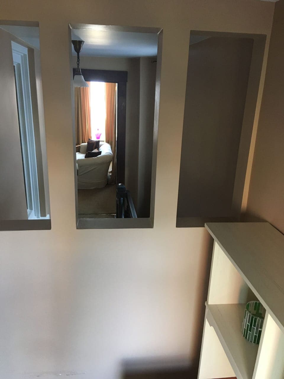 View from the office nook into the living room, overlooking the staircase up to the apartment (3)