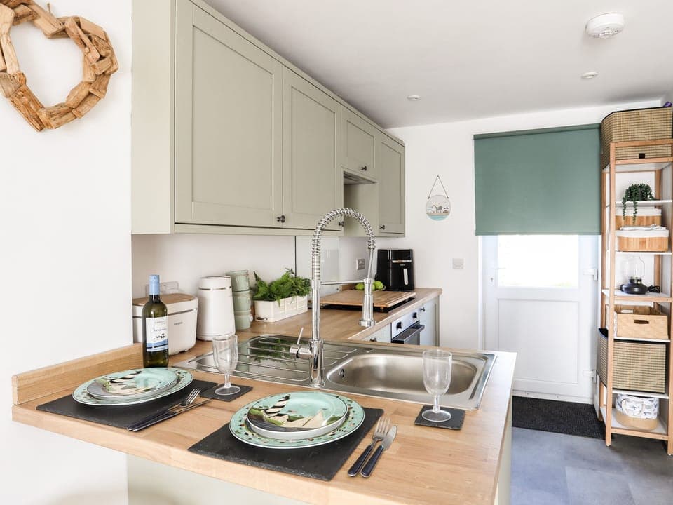 Fridge, electric kettle, toaster, cookware/dishes/utensils