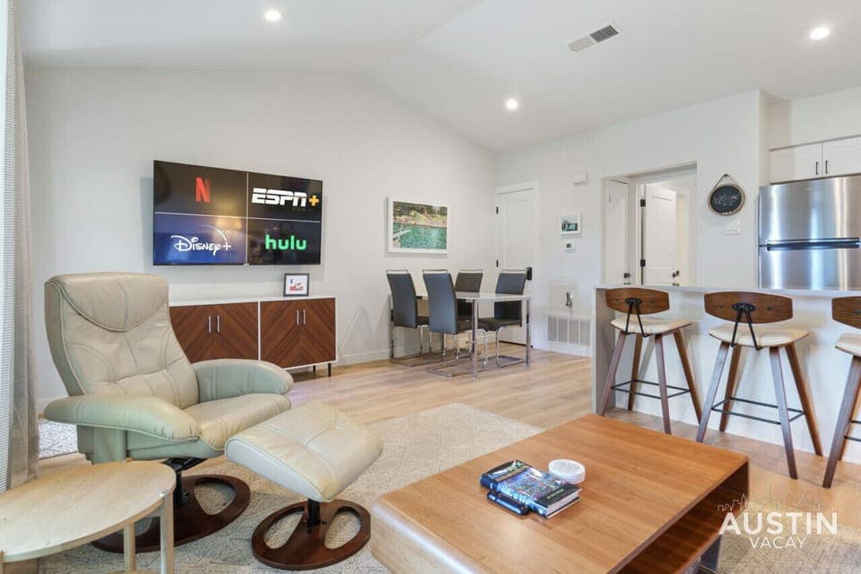 Spacious and bright living room with smart tv and sleeper sofa