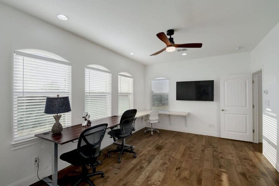 Dedicated working space that has trundle bed in it.