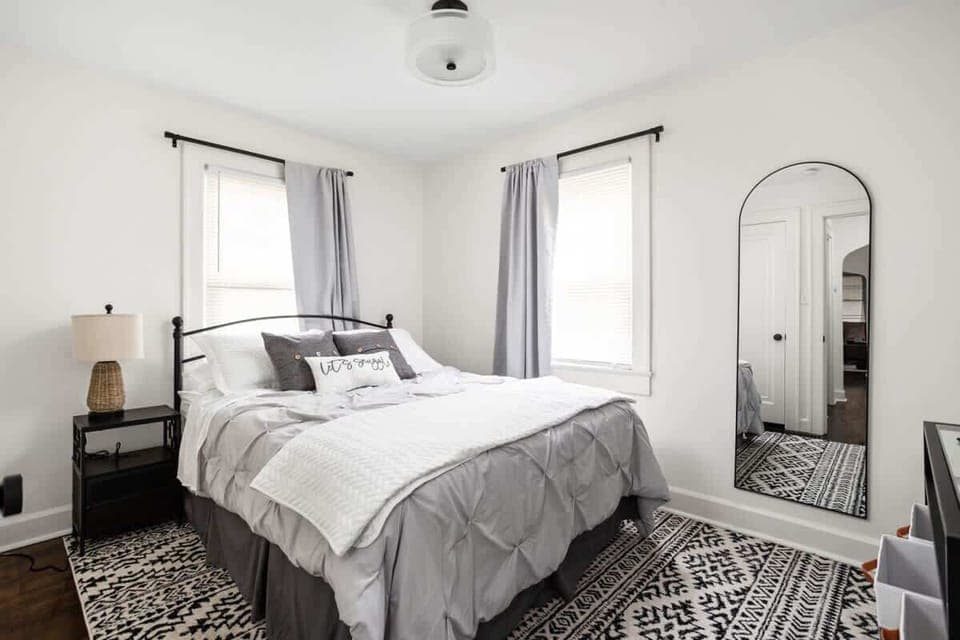 Bedroom: Experience tranquility in this stylish retreat with vibrant decor and natural light!