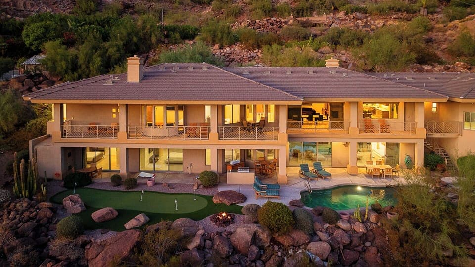 Stunning multi-level home with pool, putting green, and fire pit.