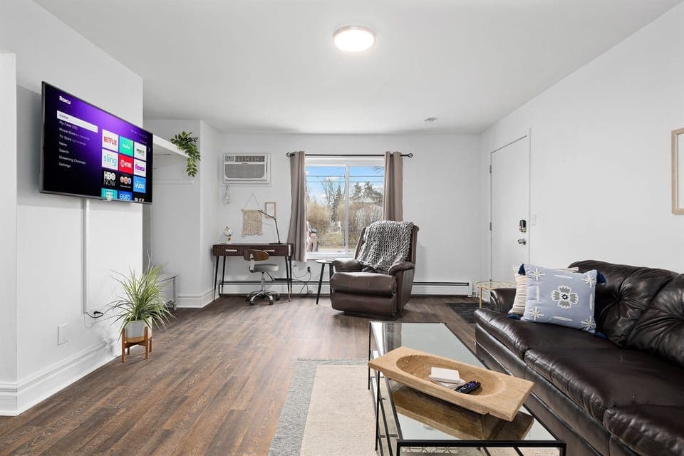Cozy up on the couch with a good book or watch your favorite movie in this relaxing living room.