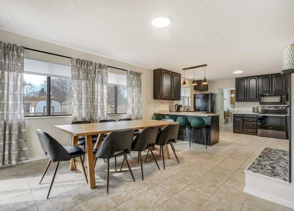 Our dining area, next to the kitchen, provides the utmost convenience. Enjoy your meals in beautiful natural light from large windows at Evergreen Luxe.