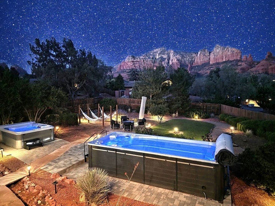Heated pool and spa with unlimited views to relax on starry night.