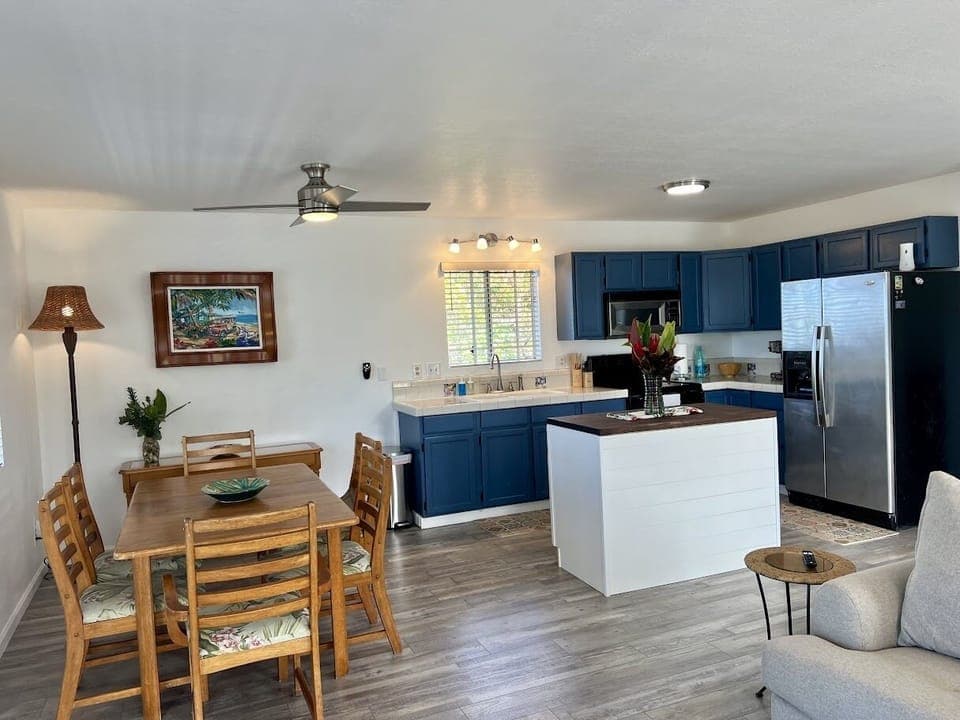 Another view of the dining area and the kitchen