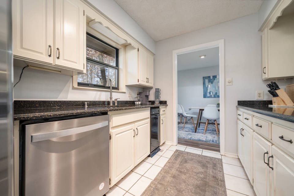Galley kitchen I stainless steel fridge and dishwasher