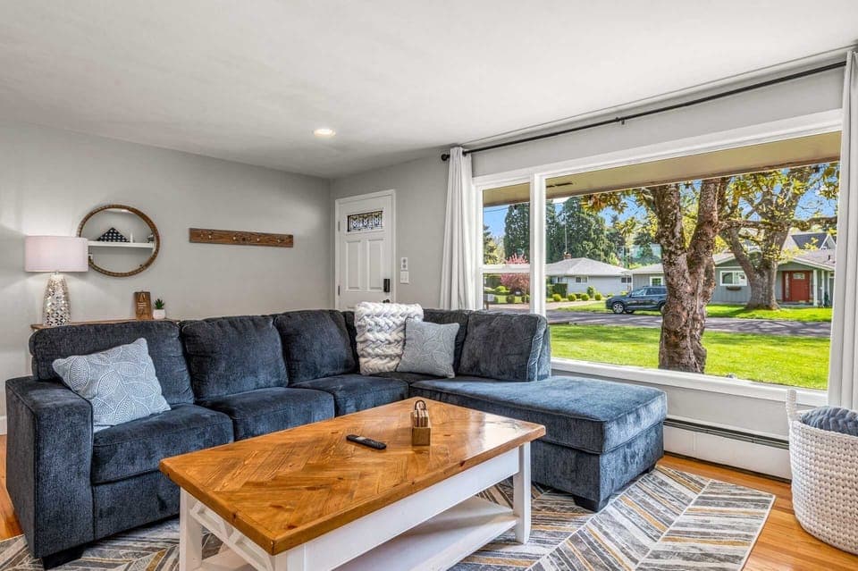 Large living room with oversized couch and plenty of seating. Very open feel