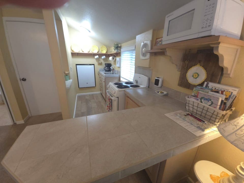 Full kitchen with all utensils.