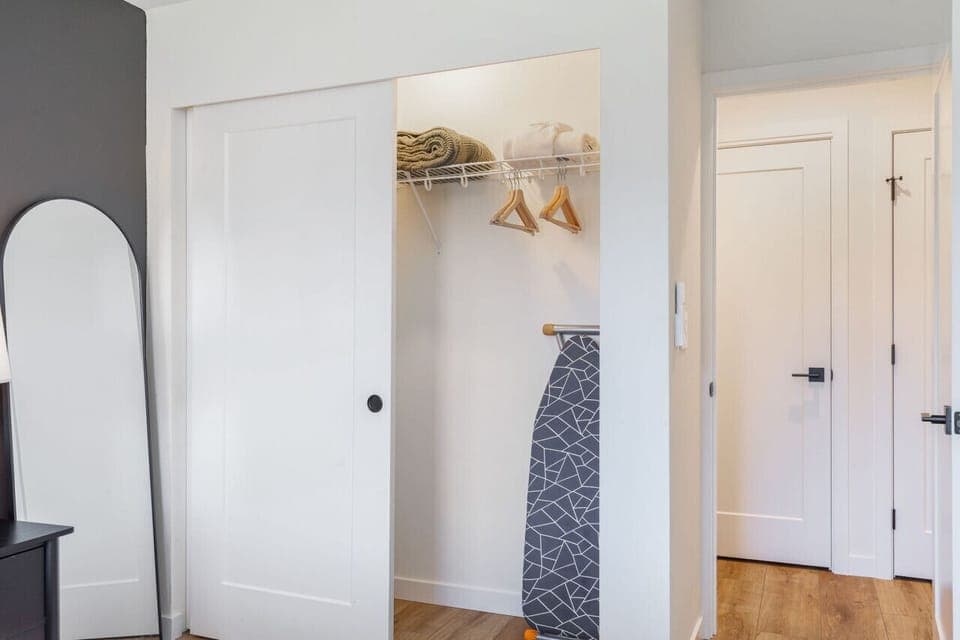 Large closet with steam iron & ironing board