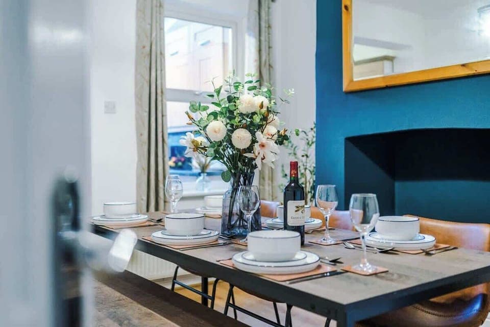 The spacious dining room has space to seat up to 6 people comfortably and is the perfect space to sit down with family and friends for an evening meal or catch up on emails if you are working remotely.
