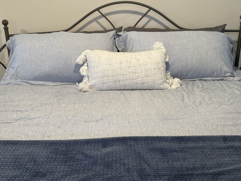 3rd bedroom upstairs by loft. King bed w/ full bathroom. Roku TV