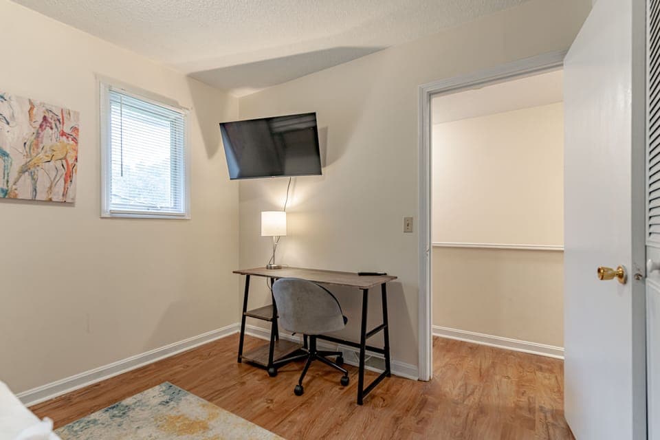 Second Bedroom with Full and Twin Bed, 32in Smart TV and desk work area.
