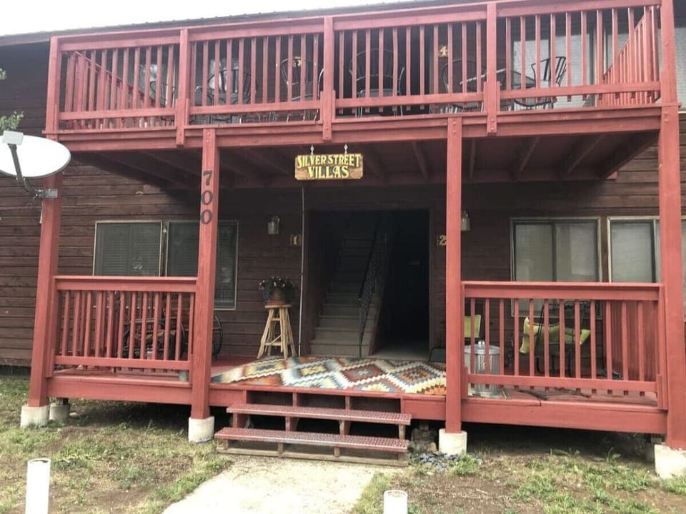 The condos feature an outside porch area for relaxing.  There is a barbeque grill available for use along side the picnic tables just off of the porch area.