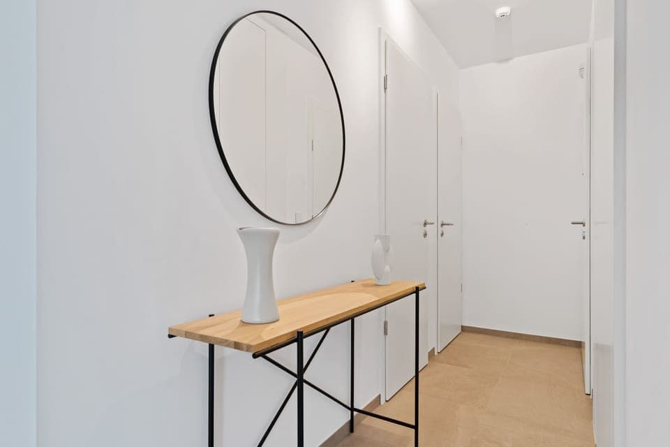 Modern dining space with a view: where city vibes meet homey comfort.