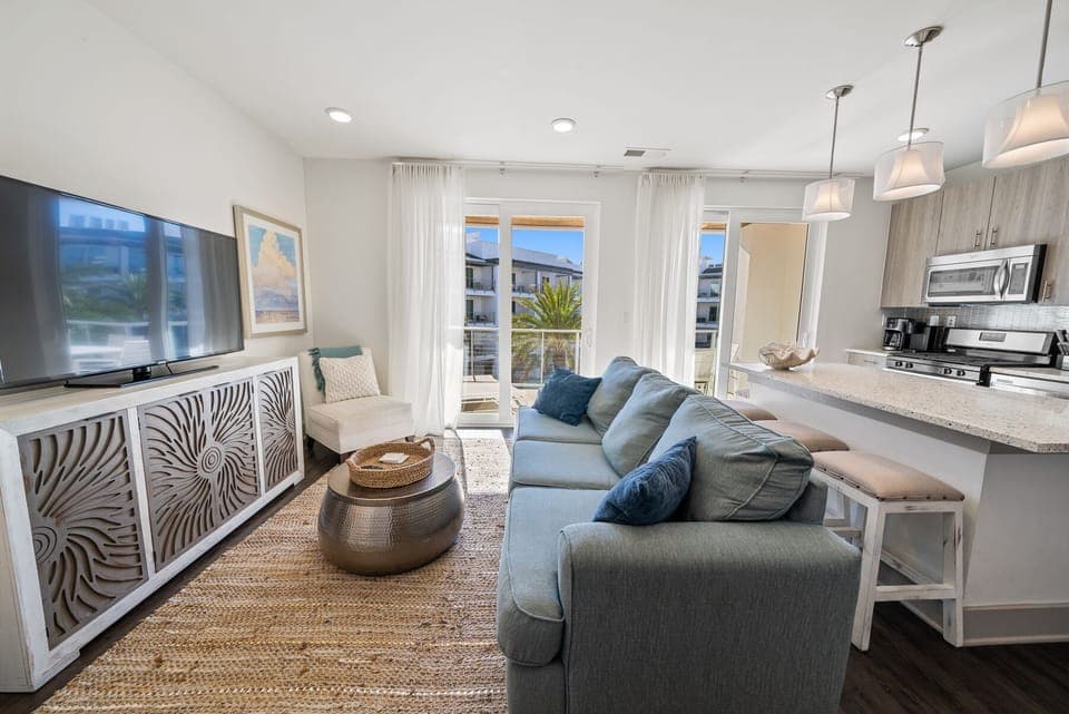 Relax in your stylish open-concept retreat where coastal blues meet modern comfort. Natural light streams through sliding doors to your private balcony.