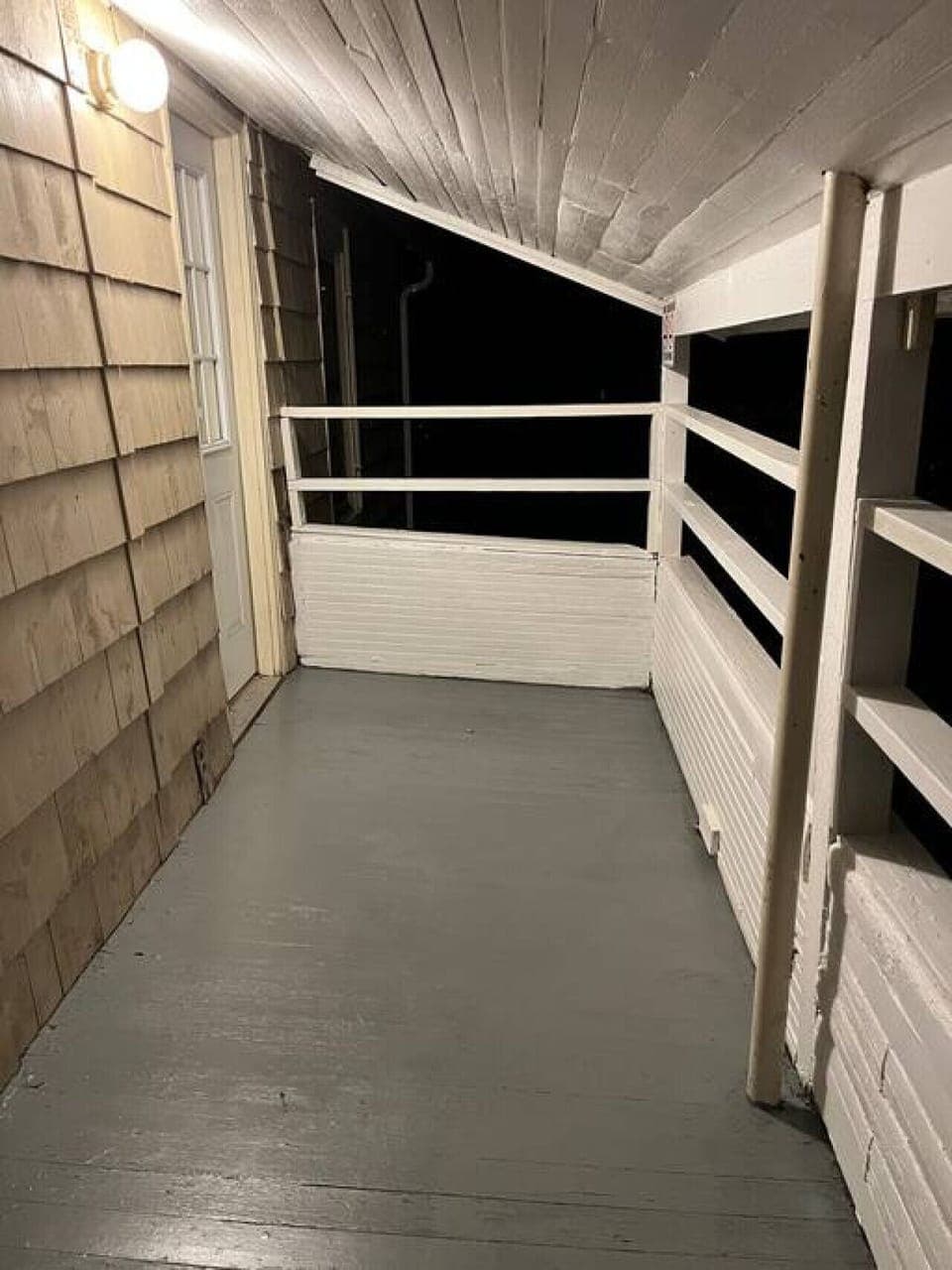 Enjoy this cozy, balcony porch.