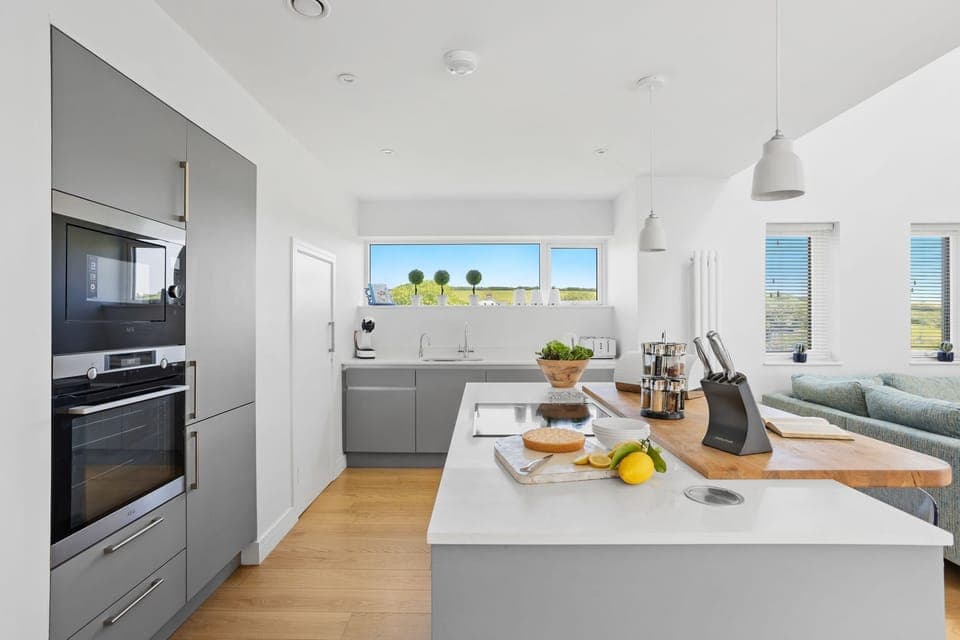 Lovely open kitchen with island and valley views from the window -  1 The Vista, Willingcott