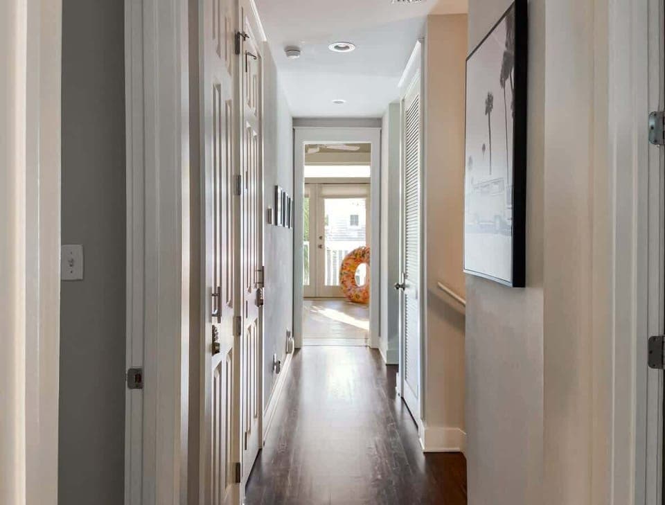 Upstairs leads to even more bedrooms and communal areas.