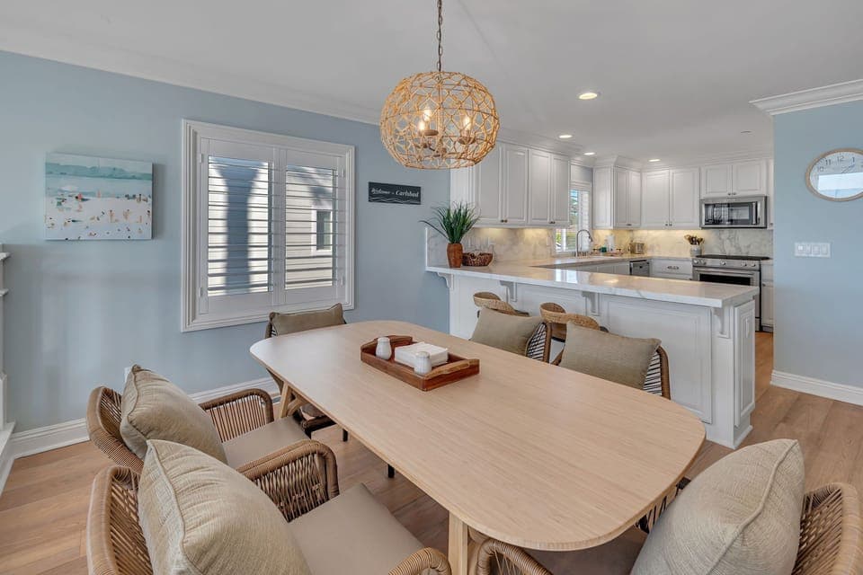 Enjoy meals at the dining area with seating for six, conveniently connected to the kitchen. Please note the home has multiple stairs and no safety gates.