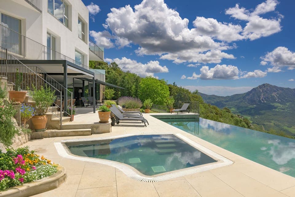 Jacuzzi, infinity edge pool, sun deck, shaded terrace and outdoor dining