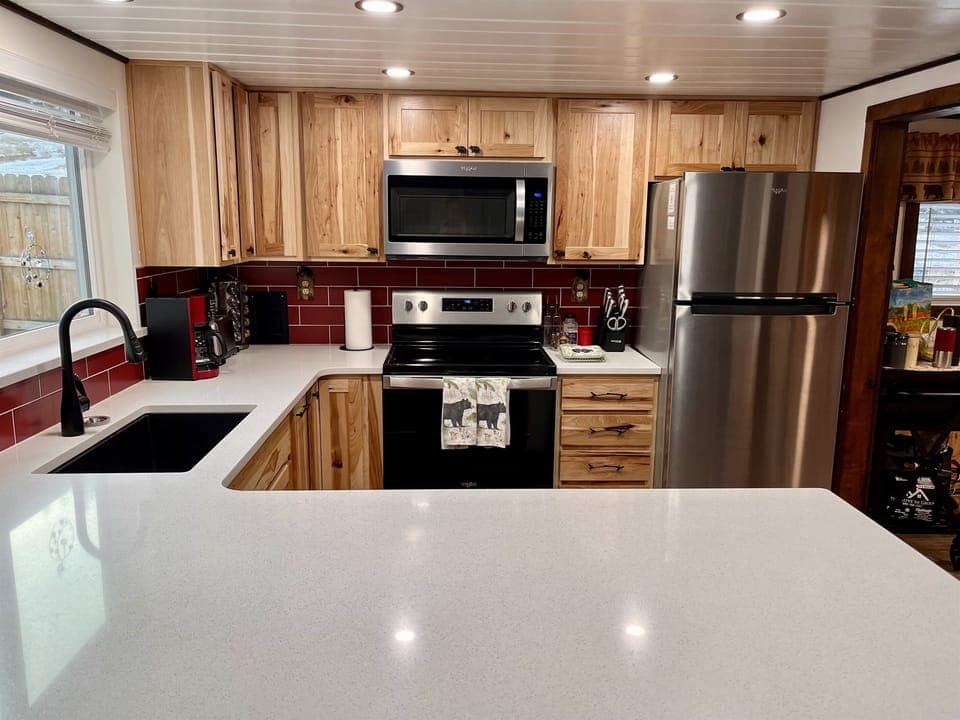 Stainless steel appliances and gorgeous cabinets