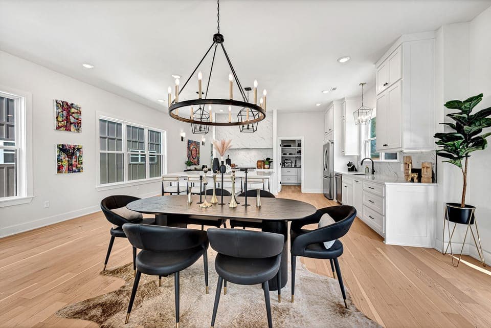 Dining area for 10 people. Table and oversized island seating at the counter.