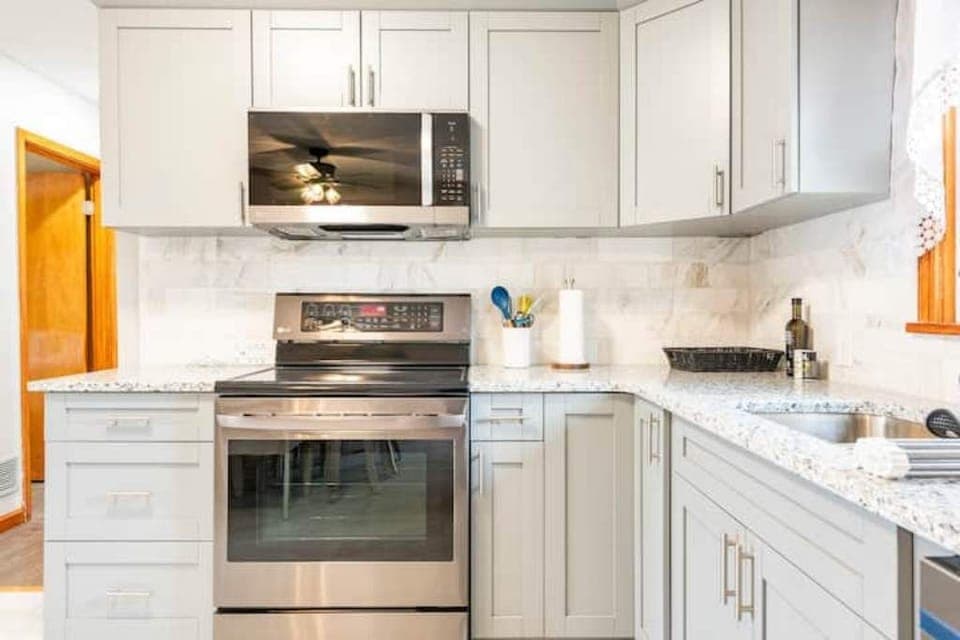 Kitchen with stainless steel appliances view 1