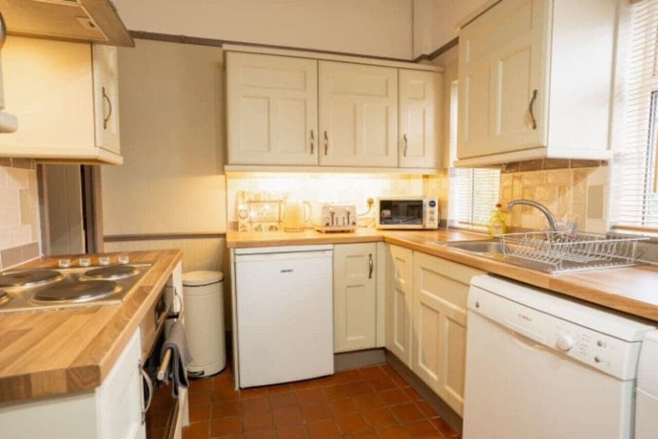 The Kitchen: the lovely shaker style kitchen comes well equipped with everything you need for a comfortable stay.