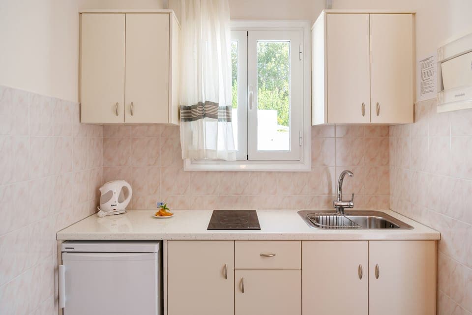 Studio with Sea View (3 Adults) | Private kitchen | Electric kettle, dining tables