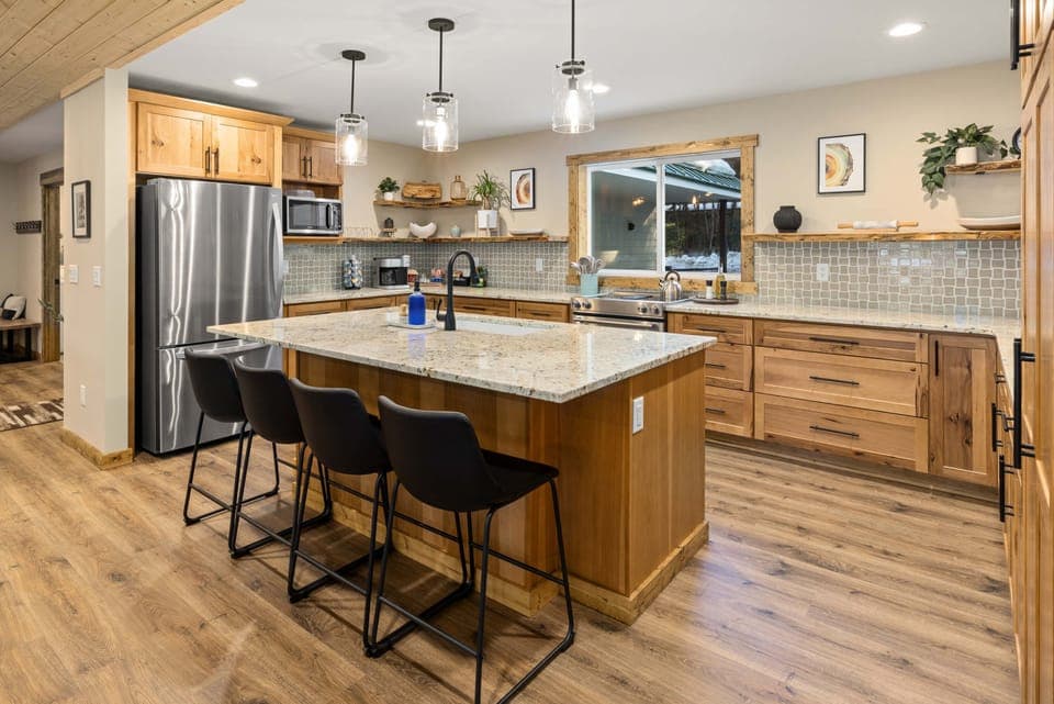 Kitchen with all new appliances, hickory cabinets and granite counters. There is plenty of room for multiple people to be food prepping at the same time.