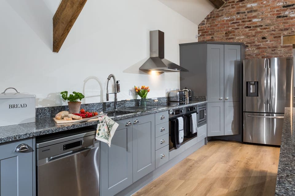 Two electric ovens and two dishwashers are located in the kitchen area