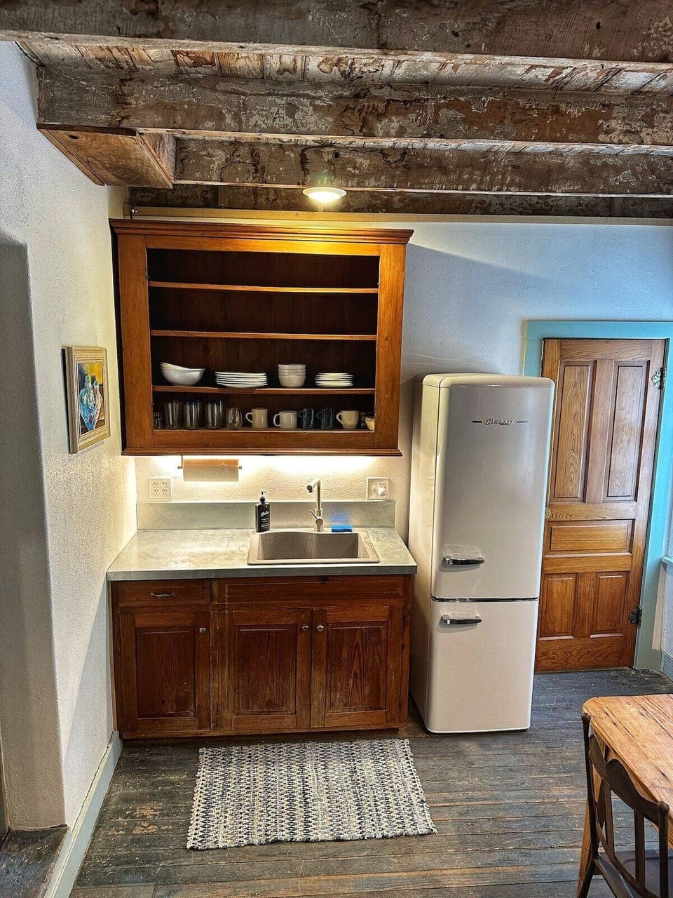 Prepare delicious meals in the charming kitchen, where vintage accents and modern conveniences come together in perfect harmony