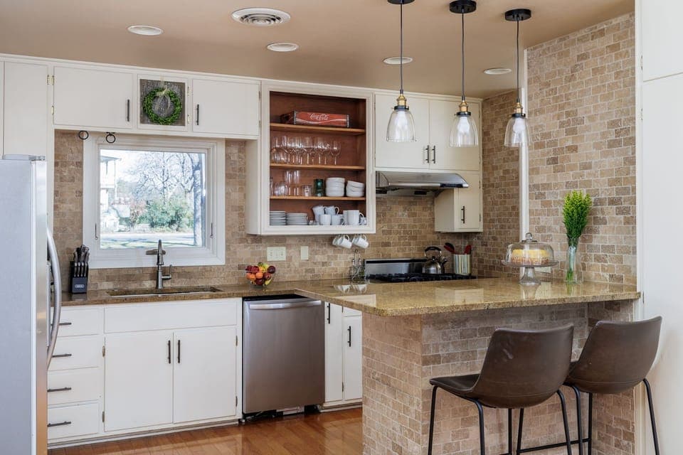 Experience the joy of cooking in the modern kitchen, equipped with top-of-the-line appliances, a spacious island, and everything you need for gourmet meals