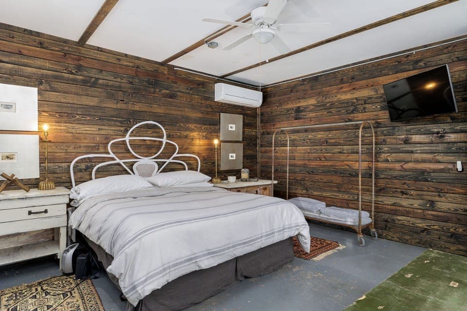 Retreat to the cozy ambiance of the master bedroom, furnished with a comfortable king-sized bed for a peaceful night's sleep.