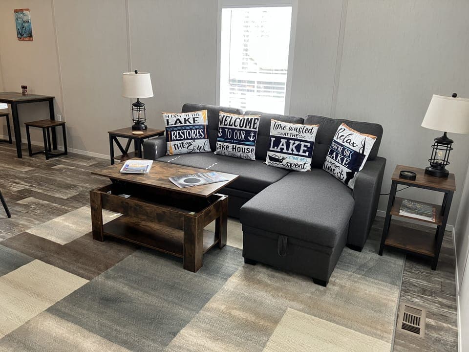 Coffee table lifts for desk work, pull out sofa with bedding storage.