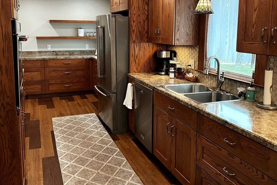 Beautiful galley kitchen with Kitchen Aide appliances. 