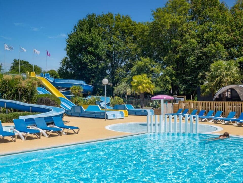 Dive into relaxation at our vibrant outdoor pool.