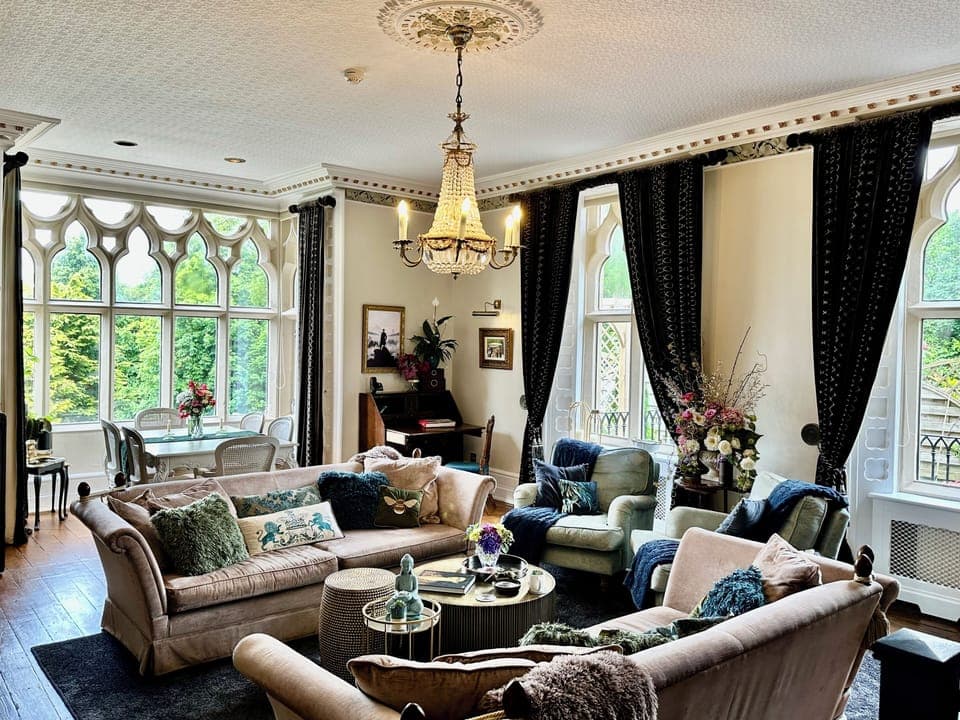 Original Drawing Room w/tie-back sofas, Mulberry drapes, Designer Guild cushions