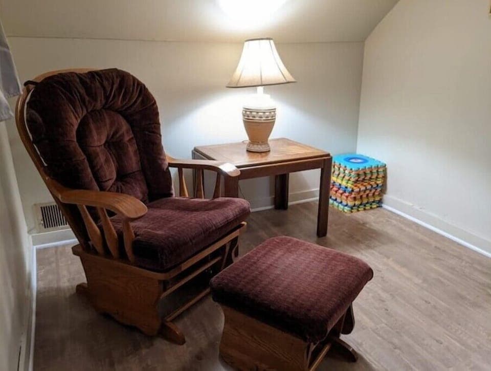 Bonus room glider rocker, includes a pack-n-play and room for kids to play. 